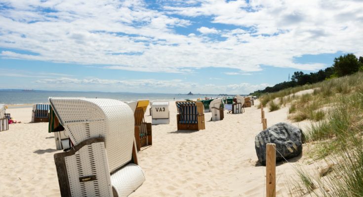 white and gray bench on seashore